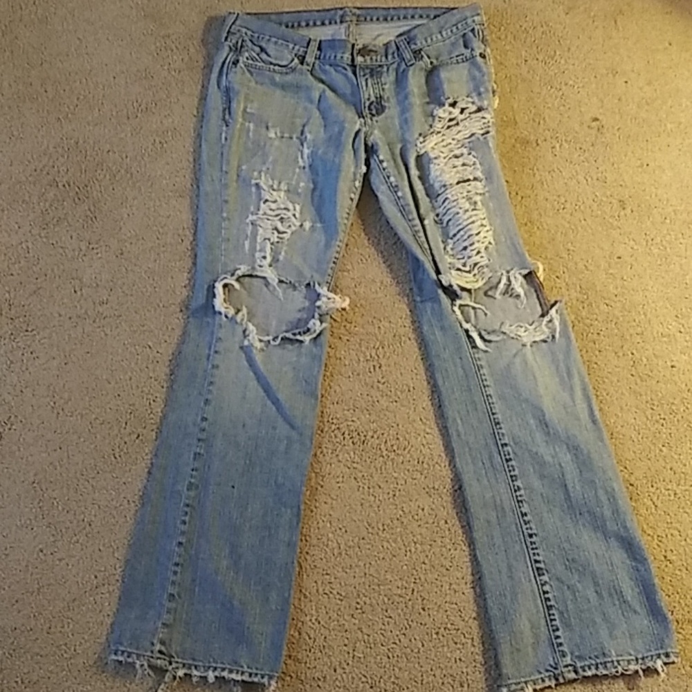 Worn-distressed The Diva blue jeans boot cut leg
